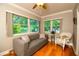 Comfortable sitting area with bright windows and a cozy couch, creating a relaxing space at 11200 102Nd Ave # 62, Seminole, FL 33778