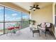 Relaxing screened-in balcony offering beautiful views of the lake and lush landscaping at 11327 Lake Lucaya Dr, Riverview, FL 33579