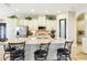 Bright kitchen with a spacious island, granite countertops, and stainless steel appliances at 11327 Lake Lucaya Dr, Riverview, FL 33579