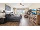Spacious main bedroom with many windows, ceiling fan and hardwood floors at 11327 Lake Lucaya Dr, Riverview, FL 33579
