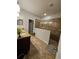 Bathroom featuring double vanity sinks, granite countertops, and a glass-enclosed walk-in shower at 11617 Brighton Knoll Loop, Riverview, FL 33579