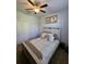 Bedroom featuring a ceiling fan, carpet flooring, a neatly made bed with neutral tones, and a closet for storage at 11617 Brighton Knoll Loop, Riverview, FL 33579