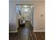 Bright entryway featuring hardwood floors and a charming bench, creating a warm welcome at 11617 Brighton Knoll Loop, Riverview, FL 33579