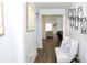 Inviting foyer featuring wood-look floors and decorative wall sconces at 11617 Brighton Knoll Loop, Riverview, FL 33579