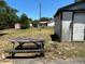 View of backyard with shed and worn picnic table at 1204 W Alsobrook St, Plant City, FL 33563