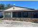 Quaint single-story home with a stone facade and screened-in porch for relaxed outdoor living at 1204 W Alsobrook St, Plant City, FL 33563
