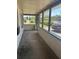 Spacious screened-in porch with ample space for outdoor seating and relaxation with neighborhood views at 1204 W Alsobrook St, Plant City, FL 33563