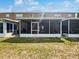 Spacious backyard with large enclosed patio at 1237 Blenheim Ct, Wesley Chapel, FL 33543