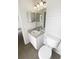 Bright bathroom features a single sink vanity with a mirror and a toilet at 1237 Blenhem Ct, Wesley Chapel, FL 33543