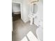 Functional bathroom featuring a sink, toilet, and tile flooring, ensuring comfort and convenience at 1237 Blenheim Ct, Wesley Chapel, FL 33543