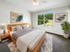 Bedroom features neutral paint, a large window with natural light and modern furnishings at 1237 Blenheim Ct, Wesley Chapel, FL 33543