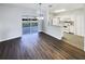 Open kitchen featuring white appliances, cabinetry, and view to outdoor living at 1237 Blenheim Ct, Wesley Chapel, FL 33543
