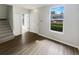 Inviting living room with modern flooring, abundant natural light, creating a warm and welcoming atmosphere at 1237 Blenheim Ct, Wesley Chapel, FL 33543