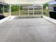 Enclosed patio with view of pond and neighboring homes at 1237 Blenhem Ct, Wesley Chapel, FL 33543
