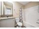 Modern bathroom with granite vanity top and a shower and tub combo, with sleek new fixtures at 13039 Keel Ct, Hudson, FL 34667