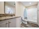 Modern bathroom featuring a granite vanity top and a shower and tub combo with updated fixtures at 13039 Keel Ct, Hudson, FL 34667