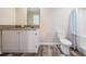Bathroom with vanity, mirror, toilet, granite countertop, and a shower with a curtain at 13039 Keel Ct, Hudson, FL 34667