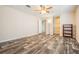 This bedroom offers great natural light and plank floors that extend into the walk-in closet at 13039 Keel Ct, Hudson, FL 34667
