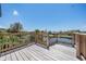 Waterfront deck features natural wood and provides a beautiful view of the surrounding canal at 13039 Keel Ct, Hudson, FL 34667