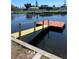 Newly constructed dock offers access to calm waters with nearby neighborhood views at 13039 Keel Ct, Hudson, FL 34667