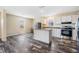 Kitchen area with granite countertops, stainless appliances, and luxury vinyl flooring at 13039 Keel Ct, Hudson, FL 34667