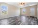 Living room features luxury vinyl flooring and natural light coming in from the windows at 13039 Keel Ct, Hudson, FL 34667