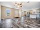 The living room features luxury vinyl flooring and lots of natural light at 13039 Keel Ct, Hudson, FL 34667