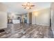 Living room featuring luxury vinyl flooring and an open concept to the kitchen at 13039 Keel Ct, Hudson, FL 34667