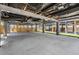 Spacious lower-level parking with concrete pad and metal support beams, ready for customization at 13039 Keel Ct, Hudson, FL 34667