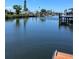 An expansive view across the water with docks and waterfront homes, with plenty of space for boats at 13039 Keel Ct, Hudson, FL 34667