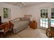 Light-filled bedroom features access to the backyard pool area and comfortable accommodations at 13878 Oak Forest N Blvd, Seminole, FL 33776