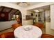 Cozy dining area with seating, a ceiling fan, and views into the kitchen and living room at 13878 Oak Forest N Blvd, Seminole, FL 33776