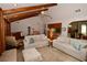 Bright living room with vaulted ceilings, wood beams, and an open layout to the kitchen at 13878 Oak Forest N Blvd, Seminole, FL 33776
