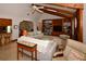 Spacious living room with wood beam ceiling is open to the dining and kitchen areas at 13878 Oak Forest N Blvd, Seminole, FL 33776