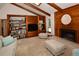 Comfortable living room with a wood fireplace and built-in bookshelves, perfect for relaxing at 13878 Oak Forest N Blvd, Seminole, FL 33776