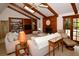 Inviting living room with vaulted ceilings, wood beams, fireplace, and built-in bookshelves at 13878 Oak Forest N Blvd, Seminole, FL 33776