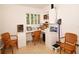 Home office boasts custom built-ins, plantation shutters, and comfortable space for 2 people at 13878 Oak Forest N Blvd, Seminole, FL 33776