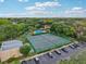 A bird's-eye view of the community pool, tennis courts and parking at 14107 Mossy Glen Ln # 203, Tampa, FL 33613