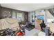 Bedroom featuring workout equipment, TV, and bright window light at 14107 Mossy Glen Ln # 203, Tampa, FL 33613