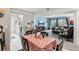 Inviting dining area with stylish table setting flowing into the living room at 14107 Mossy Glen Ln # 203, Tampa, FL 33613