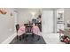 Cozy dining area with white tile floors and access to the kitchen and living room at 14107 Mossy Glen Ln # 203, Tampa, FL 33613