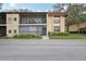 Charming condo showcasing dual balconies and well-maintained landscaping at 14107 Mossy Glen Ln # 203, Tampa, FL 33613