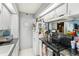 Bright kitchen with white cabinets, stainless steel appliances, and tiled floor at 14107 Mossy Glen Ln # 203, Tampa, FL 33613