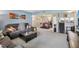 Comfortable living room featuring gray walls, plush carpeting and cozy furniture at 14107 Mossy Glen Ln # 203, Tampa, FL 33613