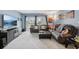 Bright living room featuring large TV, and balcony with sliding glass doors at 14107 Mossy Glen Ln # 203, Tampa, FL 33613
