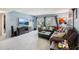 Inviting living room with blue walls, comfortable seating and sliding glass doors at 14107 Mossy Glen Ln # 203, Tampa, FL 33613