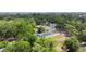 This neighborhood is in a serene, tree-lined area, featuring an in-ground pool and a well-maintained landscape at 15100 Avalon Ave, Clearwater, FL 33760