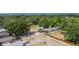 This aerial showcases well-maintained lawns and mature trees in a serene and attractive neighborhood at 15100 Avalon Ave, Clearwater, FL 33760