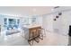 Spacious open-concept living room with a kitchen island and bright natural light at 15100 Avalon Ave, Clearwater, FL 33760