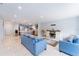 Bright, open-concept living space with tile floors connecting to the kitchen and dining area at 15100 Avalon Ave, Clearwater, FL 33760